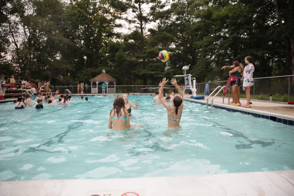 Campers play in the pool at Camp Twin Creeks