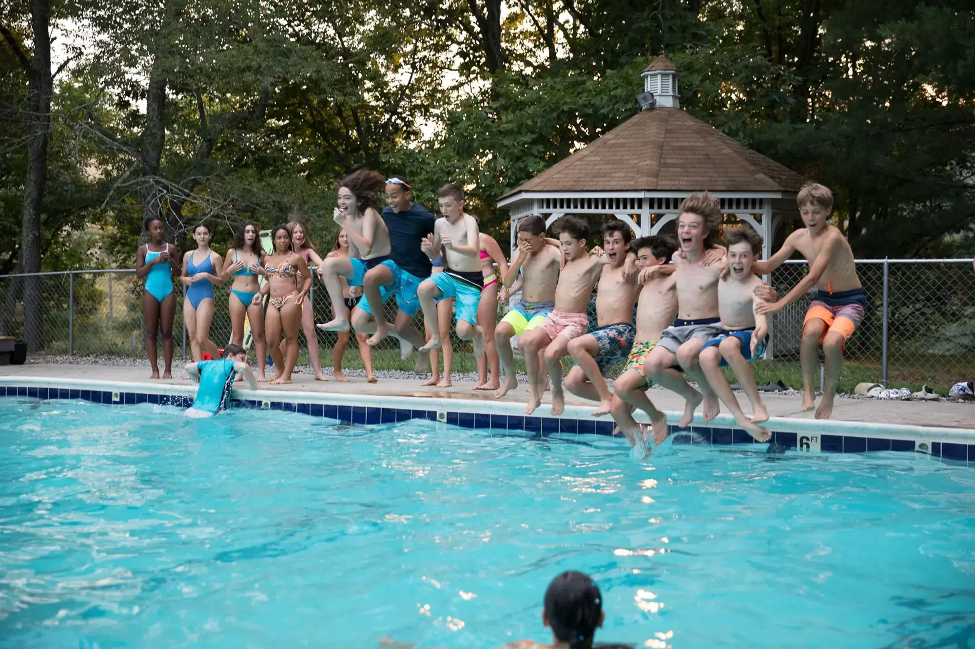 campers jump into the pool at sleepaway summer camp in west viriginia, for kids and teens from Washington DC, Virginia, Maryland, and West Virginia